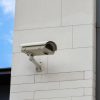 5 съвета при избор на професионална охранителна камера за вашия бизнес - surveillance camera built into stone wall building