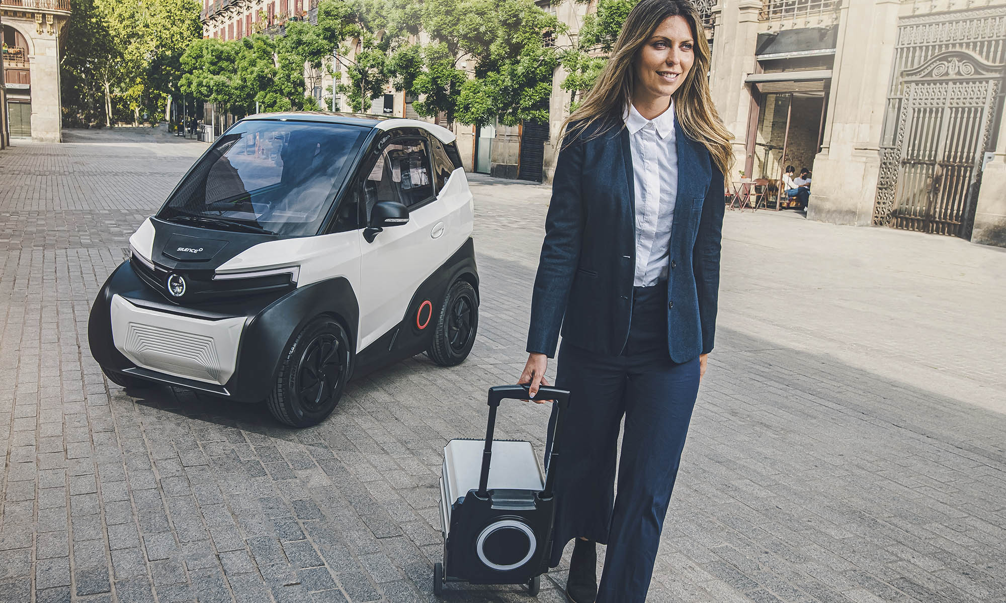 woman in front of Silence S04 with car battery