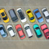 cars of different colors in a parking lot