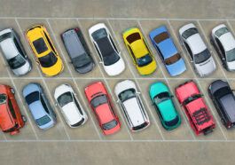 cars of different colors in a parking lot