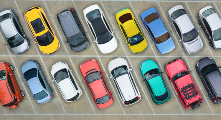 cars of different colors in a parking lot