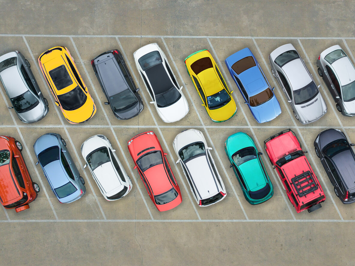 cars of different colors in a parking lot