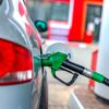 a car is refueled at a gas station