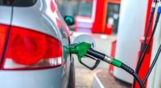 a car is refueled at a gas station