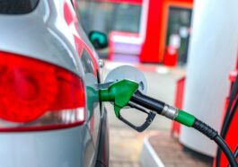 a car is refueled at a gas station