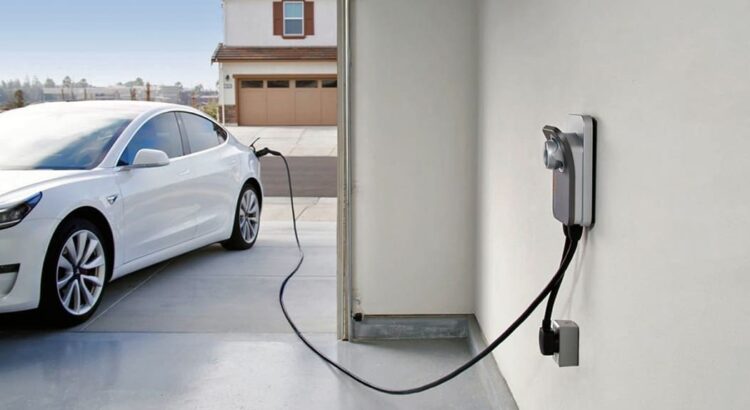 An electric car is being charged at a charging station