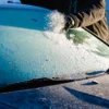 removing ice from a car windshield