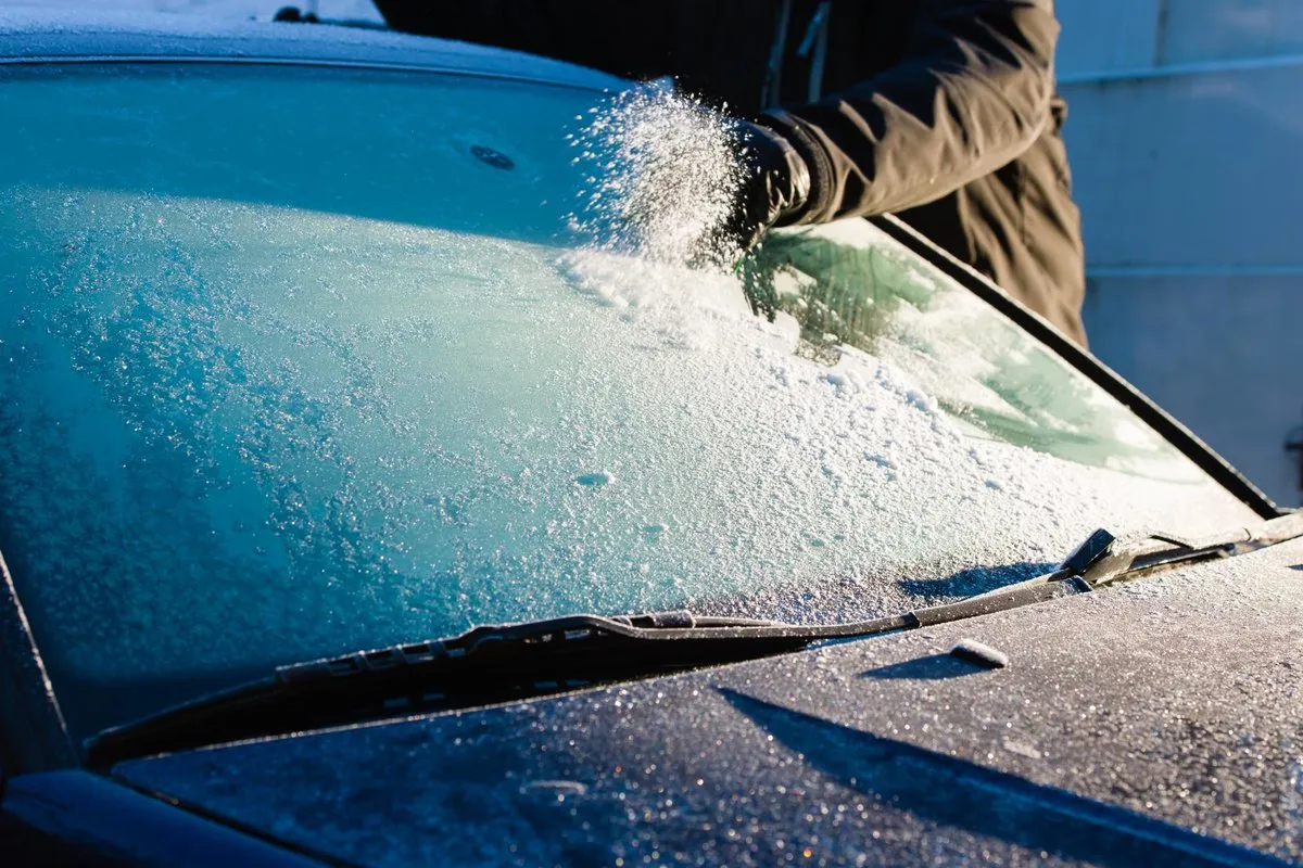 removing ice from a car windshield