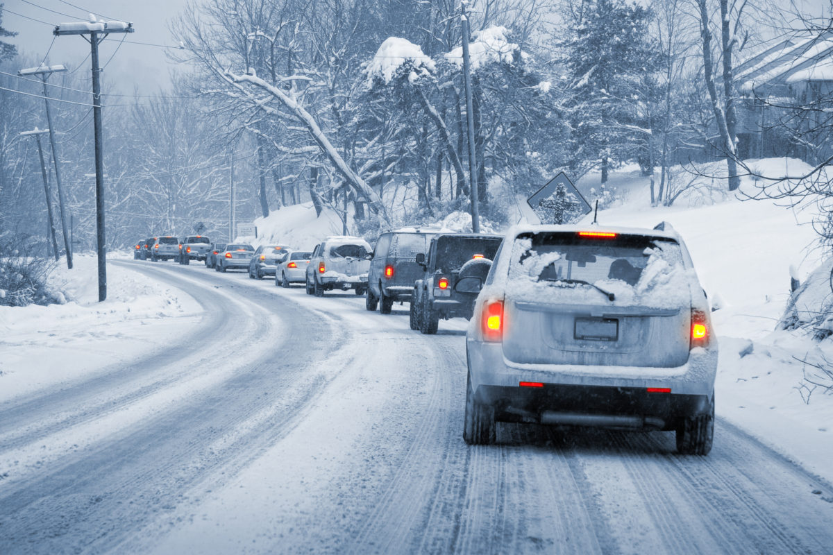 cars driving on a snowy road