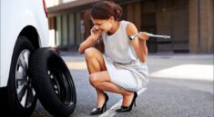 changing a flat tire on a car