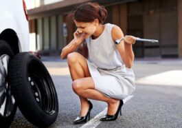 changing a flat tire on a car