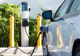white electric car charging