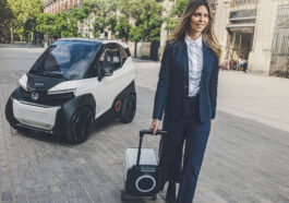 woman in front of Silence S04 with car battery