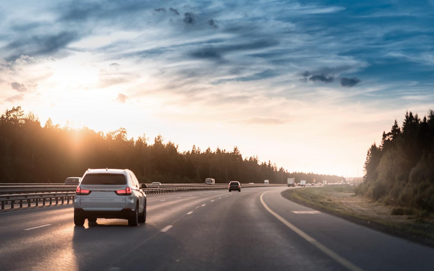 cars are driving on the highway